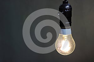 Close up one retro light lamp with copy space , bulb decorative in black background.