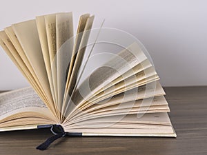 Close up of an open book with yellowish pages