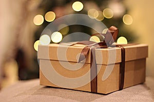 Close-up open and closed gift box with brown ribbon