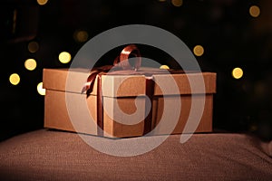 Close-up open and closed gift box with brown ribbon