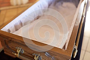 Close up of open empty coffin in church