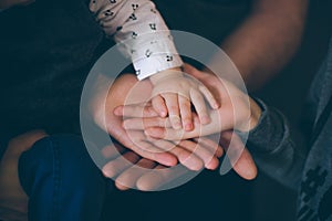 Close up open hands of man and woman and kid with palm up . Family together helping  harmony  and caring concept