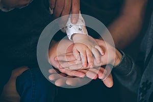 Close up open hands of man and woman and kid with palm up . Family together helping  harmony  and caring concept