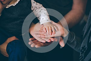 Close up open hands of man and woman and kid with palm up . Family together helping  harmony  and caring concept