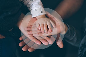 Close up open hands of man and woman and kid with palm up . Family together helping  harmony  and caring concept