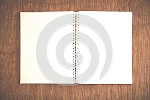 Close up open notebook on grunge wood background
