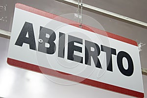 Close-up of an open sign in spanish. `Abierto` photo