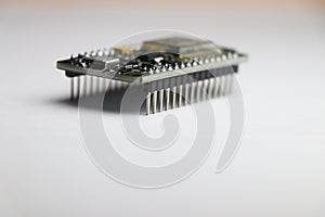 Close up of open source development board which is used in making IOT projects and other mini electronic projects in white