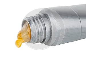 Close up of opened tube with antifriction waterproof grease isolated on white