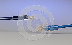 Close-up of optical patch cord lc and copper cable with plug rj45