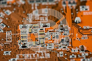 close up of Orange circuit board, motherboard technology background