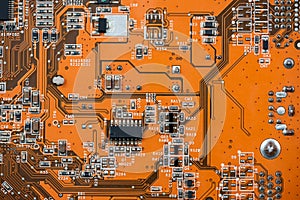 close up of Orange circuit board, motherboard technology background