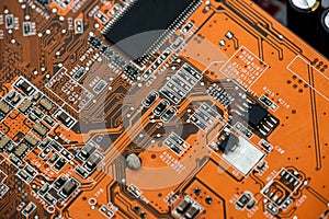 close up of Orange circuit board, motherboard technology background