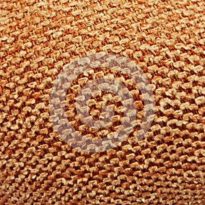 Close up of orange fabric texture. Geometric background