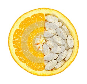 Close up of orange and pills isolated