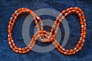 Close up orange plastic bead necklace