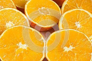 Close-up of orange pulps cut in half.