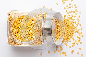 Close up of Organic Bengal Gram Cicer arietinum or split yellow chana dal in a glass jar with Lid.