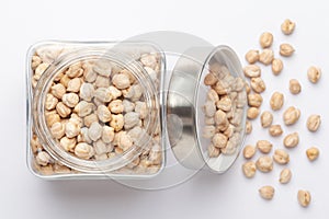 Close up of Organic chhole chana or Kabuli chana Cicer arietinum or whole white Bengal gram dal in a glass jar with Lid.