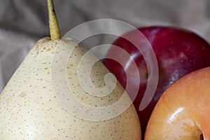 Close up of organic chinese white pear and red plum