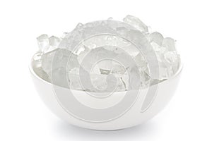 Close-up of organic  crystalline rock sugar candy misiri or mishiri  in a white ceramic bowl over white background