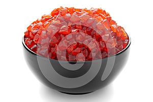 Close-up Organic red tutti frutti sweet soft candy  in black ceramic  bowl on white background photo