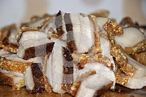 Close up Oriental Roast Crispy pork belly on wooden chopping board