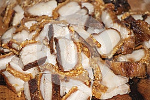 Close up Oriental Roast Crispy pork belly on wooden chopping board