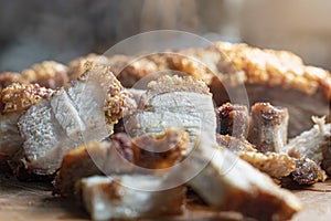 Close up Oriental Roast Crispy pork belly on wooden chopping board