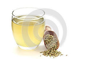 Close-Up of original  organic boiled water Tea or kada  with Sonf  or Fennel seed  Foeniculum vulgare  in a transparent glass photo