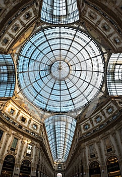 Ornate glass ceiling at Galleria Vittorio Emanuele II iconic shopping centre, located next to the Cathedral in Milan, Italy