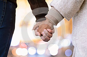 Close up outdoor protrait of african american couple holding hands
