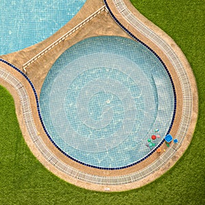 Close up outdoor swimming pool and toys with clear clean water