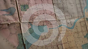 Close-up of outline map details. Stock footage. Details of marked area on contour map. Old contour map with markers and