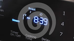 Close up of oven display flickering, control panel blinking. Electricity problem