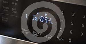 Close up of oven display flickering, control panel blinking. Electricity problem