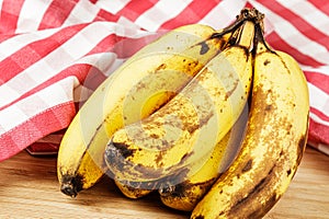 Close up of Over Ripe Bananas isolated of a wooden