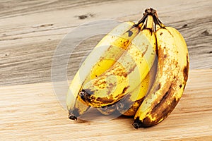 Close up of Over Ripe Bananas isolated of a wooden