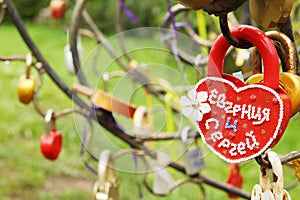 Close up of padlock in form of heart with names