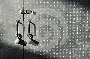 Close up Padlock with old iron gate background.