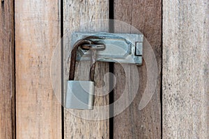 Close up of padlock and old metal hasp