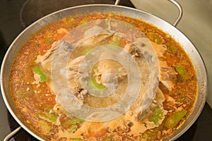 Close-up of a paella that is in the process of cooking