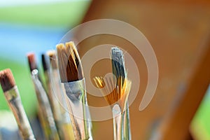 Close up of paint brushes outdoors