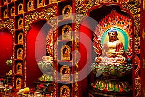 Close-up on a Buddha statue inside the Buddha Tooth Relic Temple in Chinatown District, Singapore