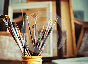 Close up of painting brushes in studio of artist