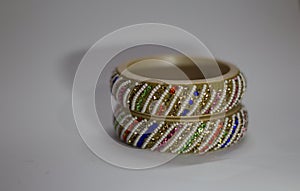 Close up of pair of bangles isolated on white background with space for text
