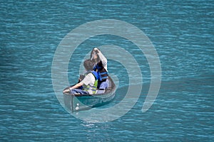 Close up of pair of canoeists on Moraine Lake in The Canadian Rockies, Banff National Park, Alberta, Canada