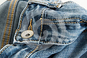 Close-up of a pair of jeans with the word