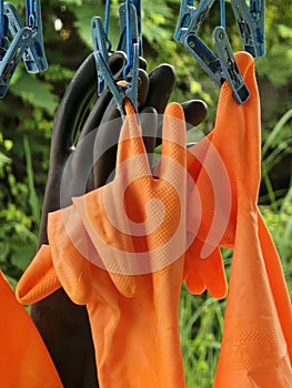 close - up of a pair of orange rubber gloves