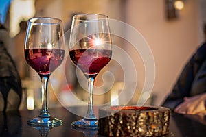 Close Up of a Pair of Red Wine Glasses on a Table